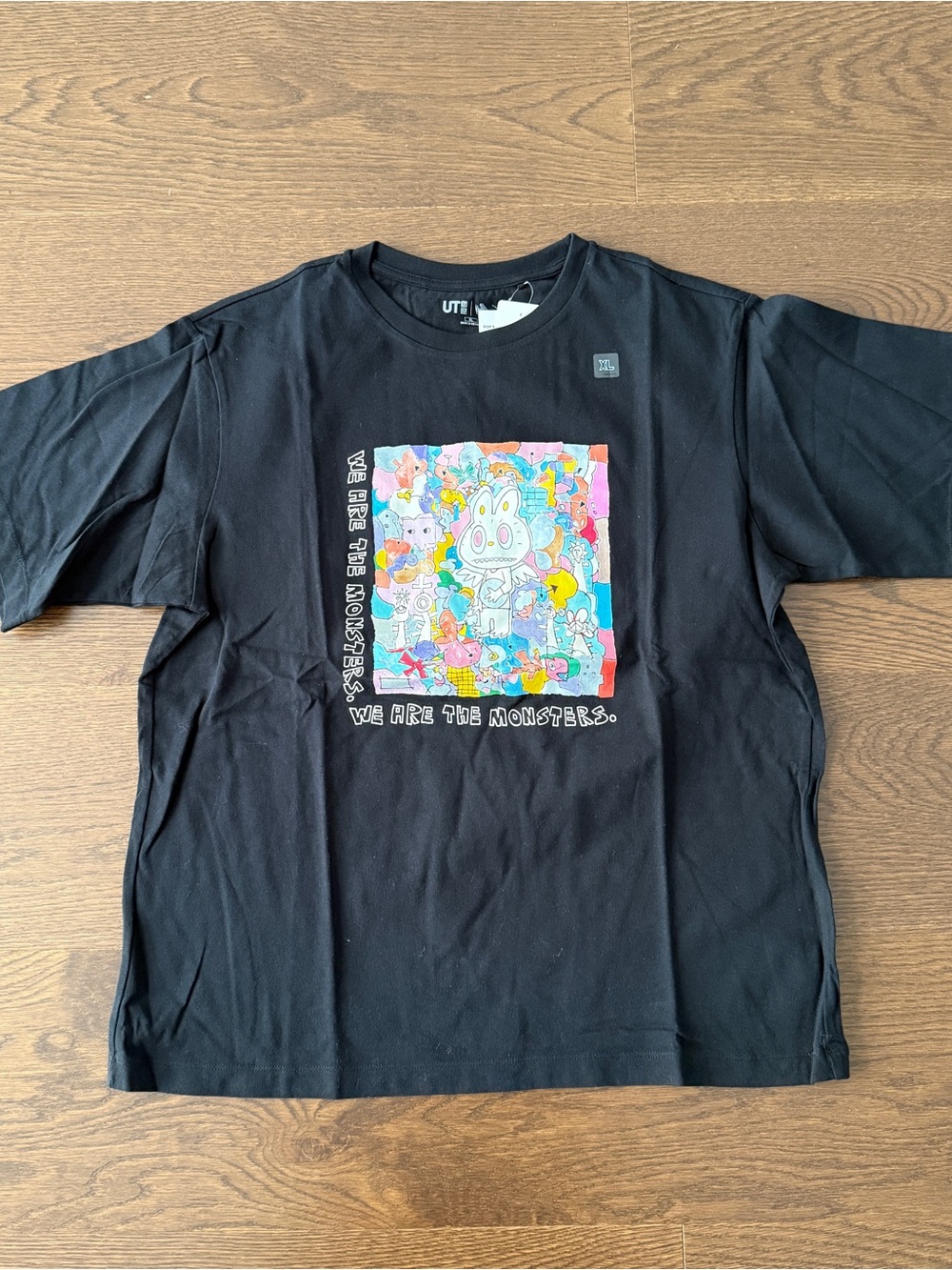 Uniqlo Black Short Sleeve Tee with Colorful Monster Art
